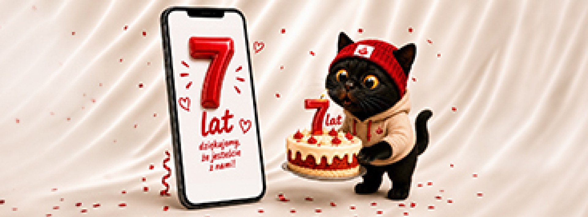7. urodziny aplikacji Santander Consumer Bank – telefon z cyfrą 7 i kot w urodzinowej czapeczce trzymający tort.